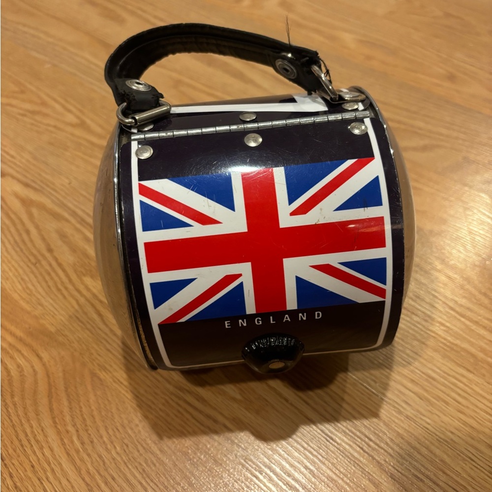 novelty purse/handbag.  UK license plate with hubcap sides.